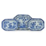 Three Chinese blue and white plates, mid 18th century, each decorated with pagodas, birds, and a