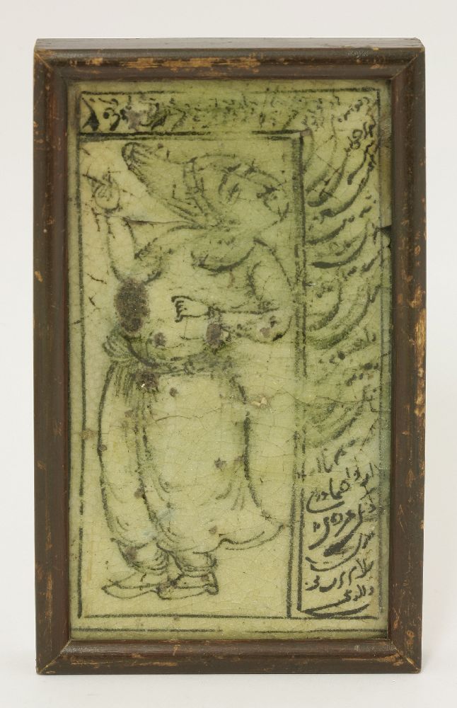 An Iranian ceramic tile fragment, 18th century, decorated with a Savafid figure with cufic script