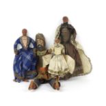 Three Belgian dolls, with wax heads, clothed, and a carved wooden knight figure. Tallest 45cm
