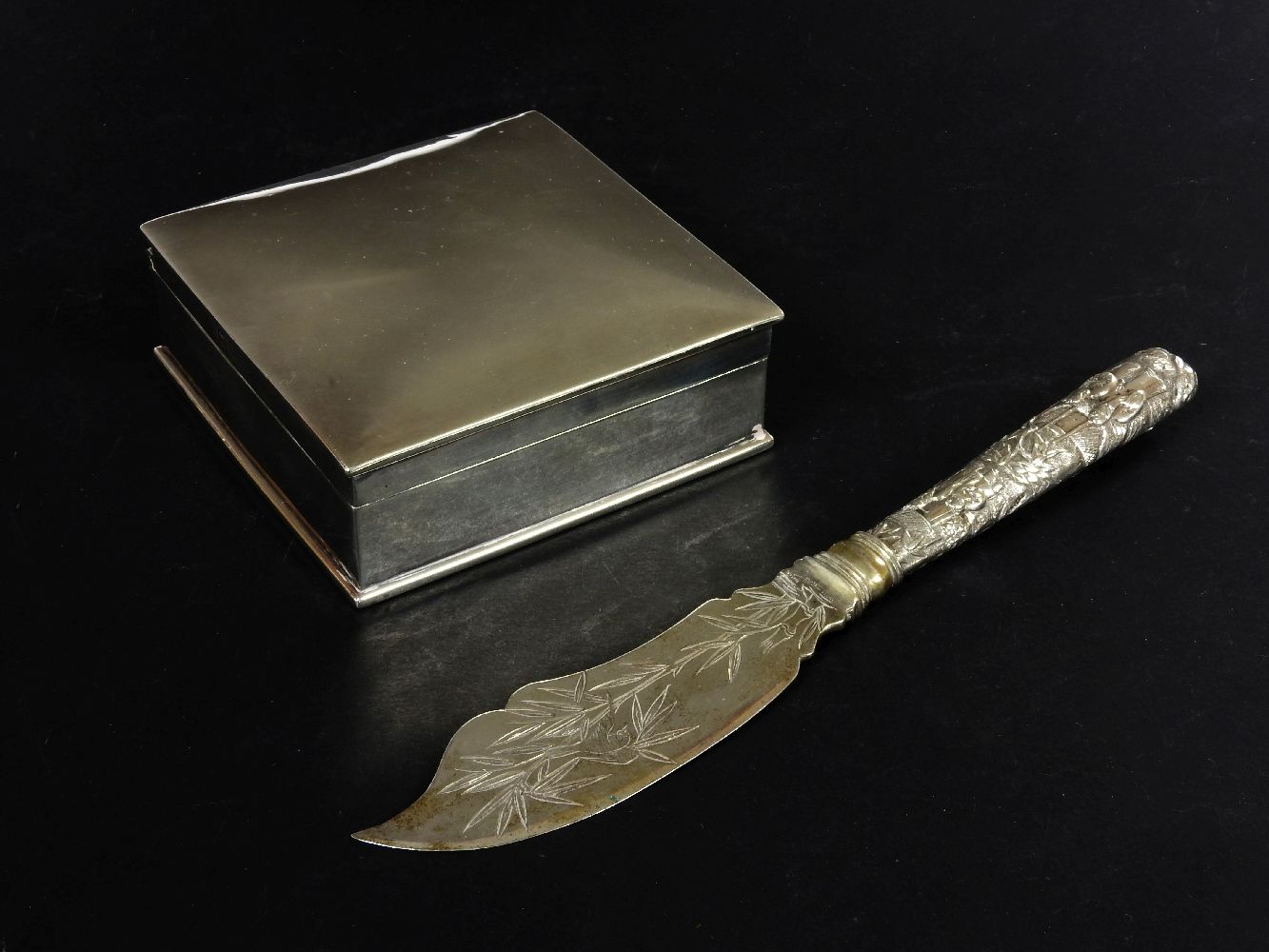 A silver cigarette box, with a dome top, plain body, 9cm wide, and a Chinese silver butter knife,