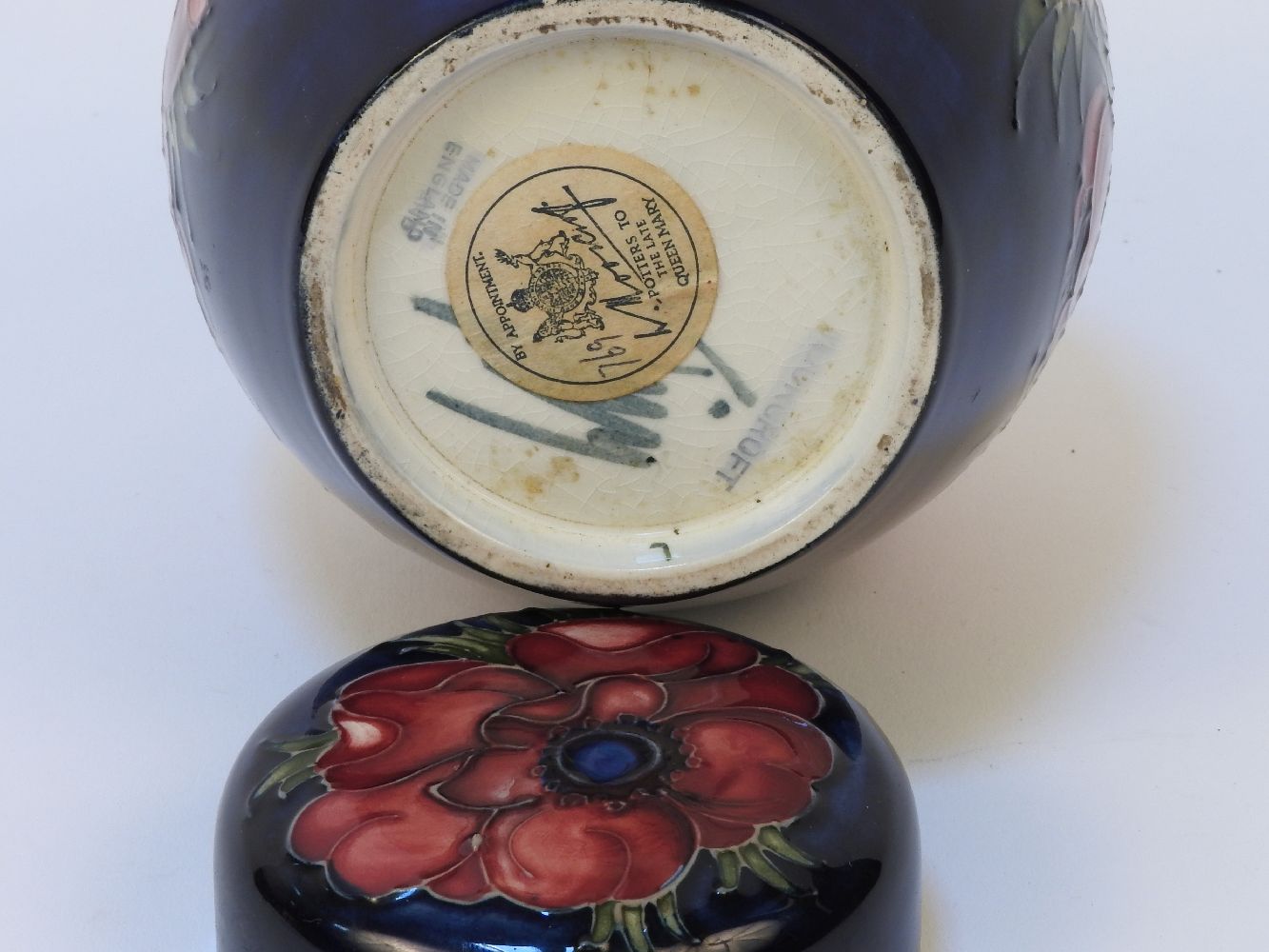 A Walter Moorcroft Clematis pattern ginger jar and cover, the blue glazed body with tube line - Image 2 of 2