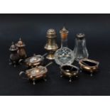 A silver cruet set, together with one other, a caster, vinegar bottle, etc