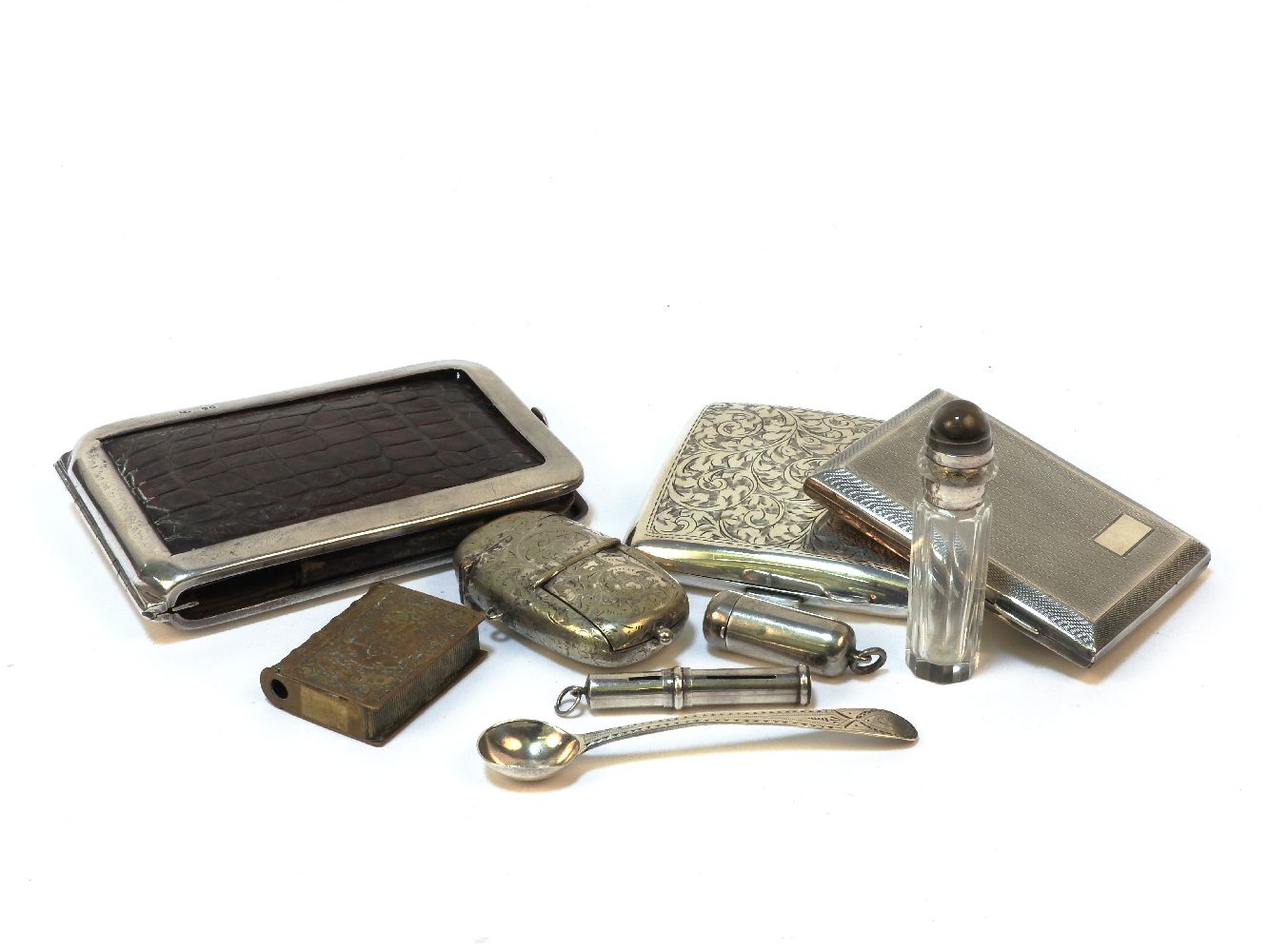 A silver and faux crocodile skin wallet, together with two silver cigarette cases, a silver plated