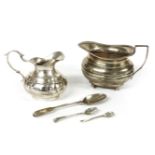 A continental silver milk jug and a silver jug, Sheffield, and spoons