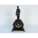 A Victorian black slate mantel clock, surmounted with a bronze figure, the movement stamped ;