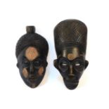 Two carved African masks, painted and incised decoration, both inscribed Liberty's London, 1962,