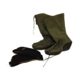 An assortment of military clothing and accessories, to include boots, hats, belts, water cans,