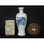 A 19th century Japanese carved Ivory card case with figural decoration (AF), and oriental blue and