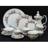 A Royal Albert 'Lorraine' pattern dinner and tea service, with grape and vine decorated border