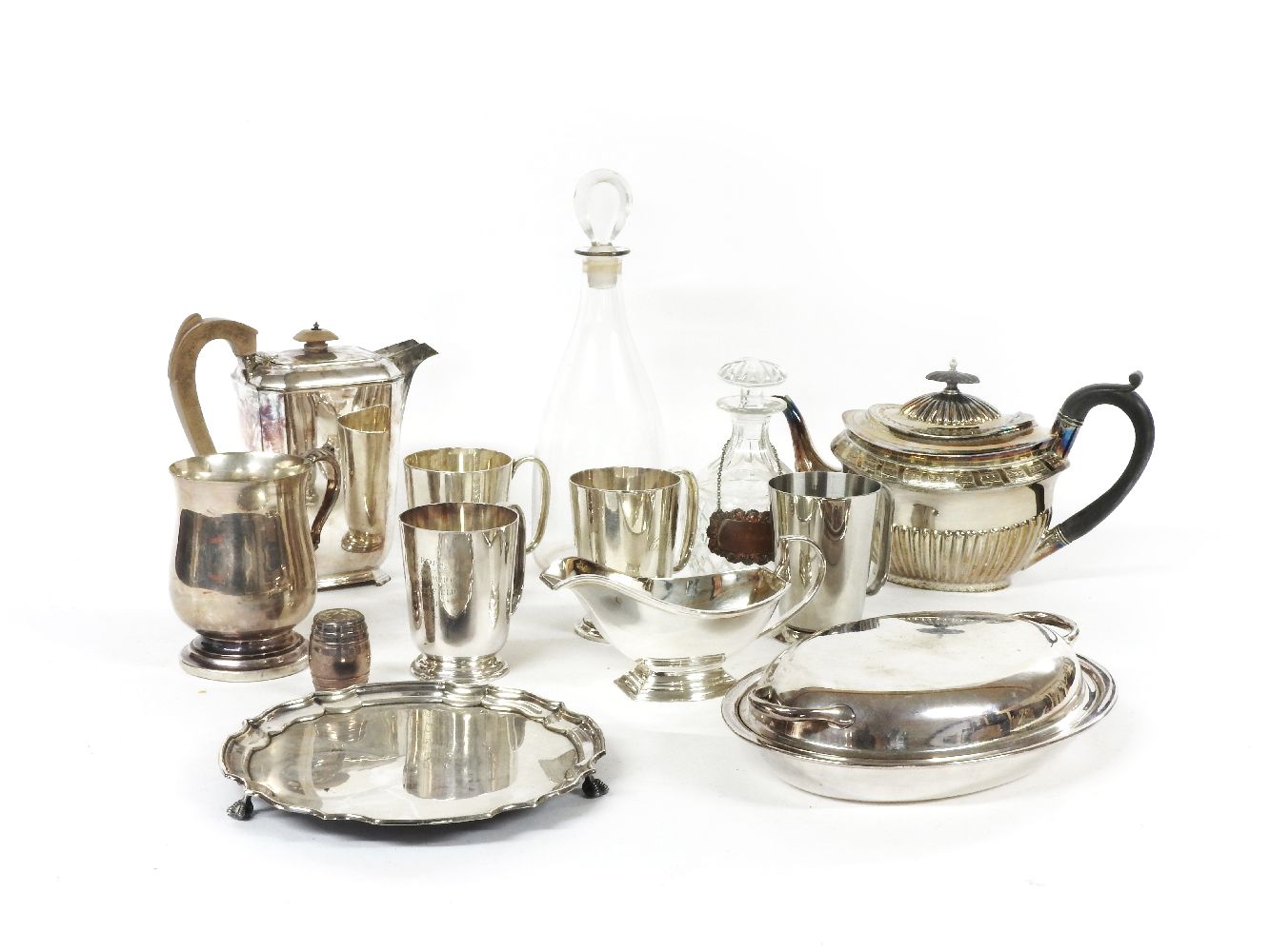 A collection of mixed silver plated wares, and two decanters