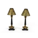 A pair of Regency gilt bronze candlesticks, with shades, 22cm high to top of sconce