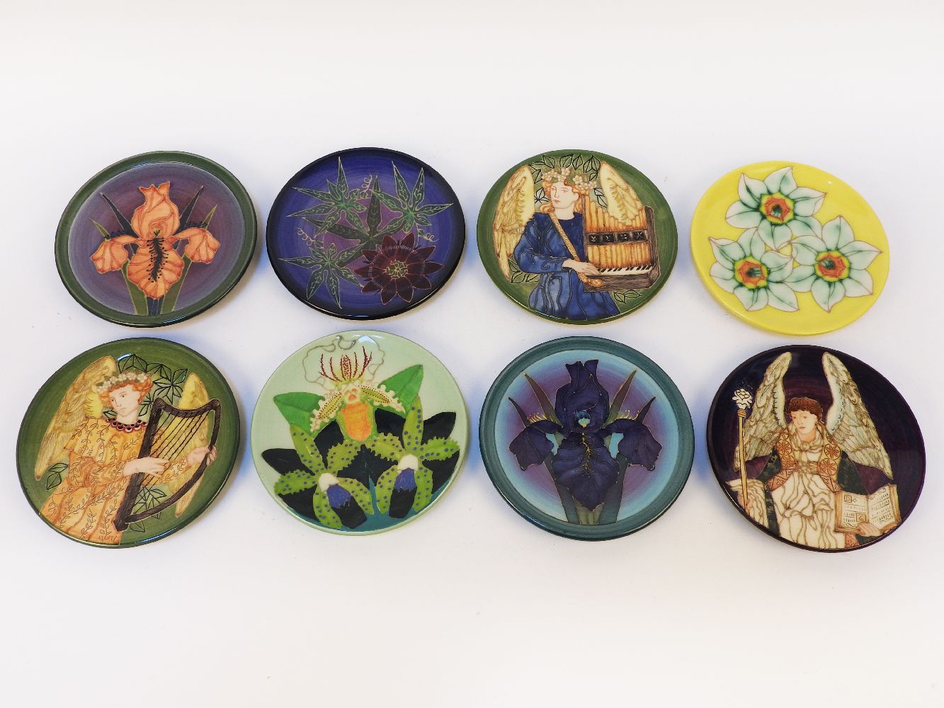 Eight Dennis Chinaworks dishes, designed by Sally Tuffin, with flowers and figures, 15.5cm diameter