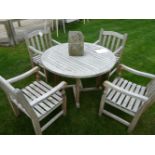 A Barlow Tyrie circular hardwood garden table and four chairs. 109cm diam.