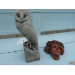 A life size figure of a barn owl, together with a wall pocket of a young girl, 39.5cm high