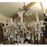 A gilt metal ten branch chandelier of French design, with cast acanthus detail