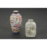 A Chinese moulded snuff bottle, with a dragon and a pheonix, 8cm high, and another interior