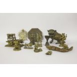 A collection of Indian metalwares, late 19th century, including a Buddhist lion candleholder and a