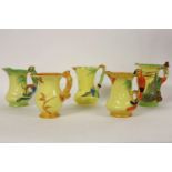 Five Burleigh ware jugs, each handle moulded as a parrot, a goblin, a squirrel, and a kingfisher,