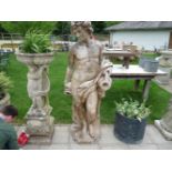 A large Italian composition statue of a youth holding a pitcher, piped as a fountain. 184cm high