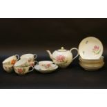 An early 20th century Meissen tea service, with hand painted foliate decoration
