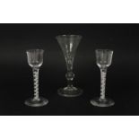 Two similar Georgian double air twist wine glasses, 14.5cm, and another with a trumpet bowl, over
