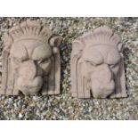 A pair of Art Deco style terracotta(?) wall pockets, in the form of lion masks, 45 x 40cm , by