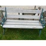 A garden bench, with iron ends and hardwood slatted back and seat. 157cm wide