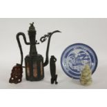 A selection of oriental items, including a carved mask, an eastern ewer, a blue and white plate, a