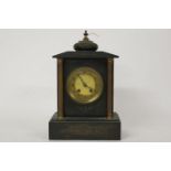 A Victorian black slate mantel clock, the gilt metal dial fitted gong strike movement within
