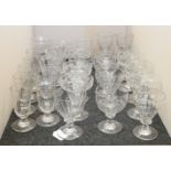 A matched set of six Victorian wine glasses, of trumpet form, with swirled bowls, and engraved