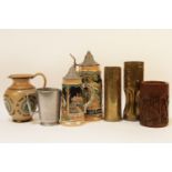 A Doulton stoneware 'He That buys...' jug, together with two steins, a Chinese brush pot, a metal