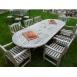 A Barlow Tyrie hardwood garden table and eight chairs, extending from 2m to 2.7m