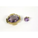 A gold oval cut amethyst brooch, with later fitting, and a gold heart shaped amethyst pendant