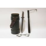 A Second World War bayonet, a police truncheon, a pair of handcuffs, and an artillery case