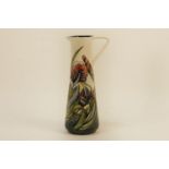 A Moorcroft 1997 Collectors Club jug, with iris decoration and strap handle, by Rachel Bishop,