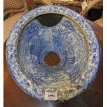 A 19th century blue and white transfer printed toilet pan, decorated with scenic views and