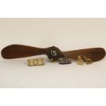 A laminated wooden model propeller, stamped T28083 and mounted with an RFC cap badge, together