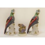 A pair of 20th century Sevres style porcelain parrots, decorated in polychrome, with gilt