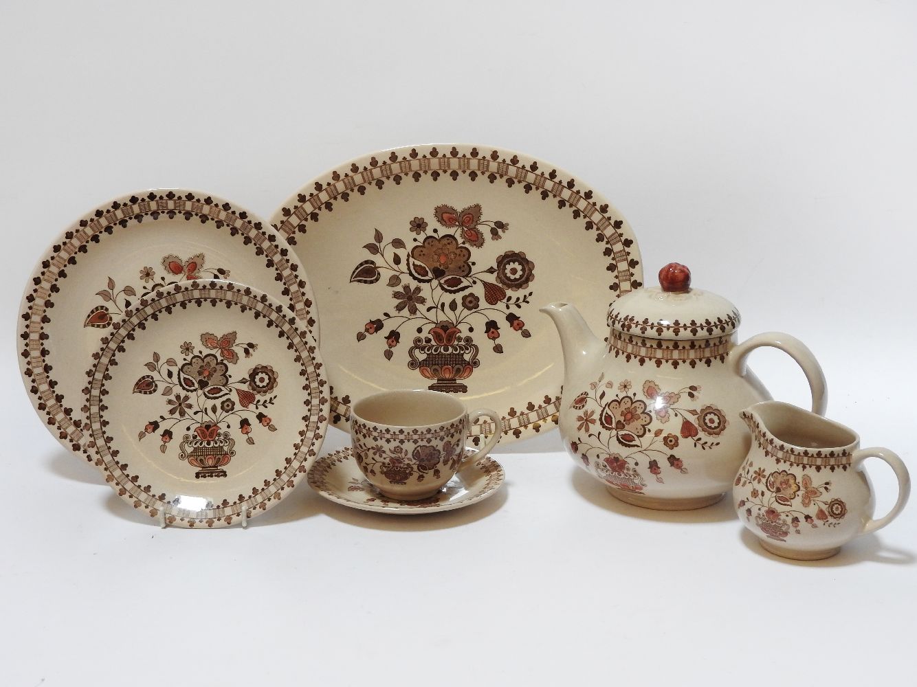 A Johnson Brothers dinner/ tea service, the brown glaze with transfer decoration