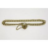 A 9ct gold double curb link chain bracelet, with a padlock clasp and safety chain, Birmingham