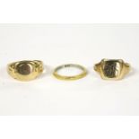 An 18ct gold signet ring, hallmark rubbed, 7.58g, a 9ct gold signet ring 3.18g, and a wedding ring