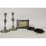 A silver framed desk calendar, together with a pair of pewter candlesticks, and two pairs of opera