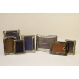 Four silver photo frames, and three others