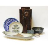 A studio pottery fish dish, an Iznik charger, and five other items of studio pottery