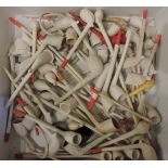 A collection of clay pipes, some with carved figurehead bowls