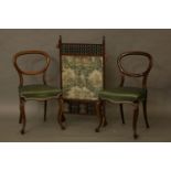 A pair of Victorian rosewood balloon back dining chairs, and a Moorish design fire screen