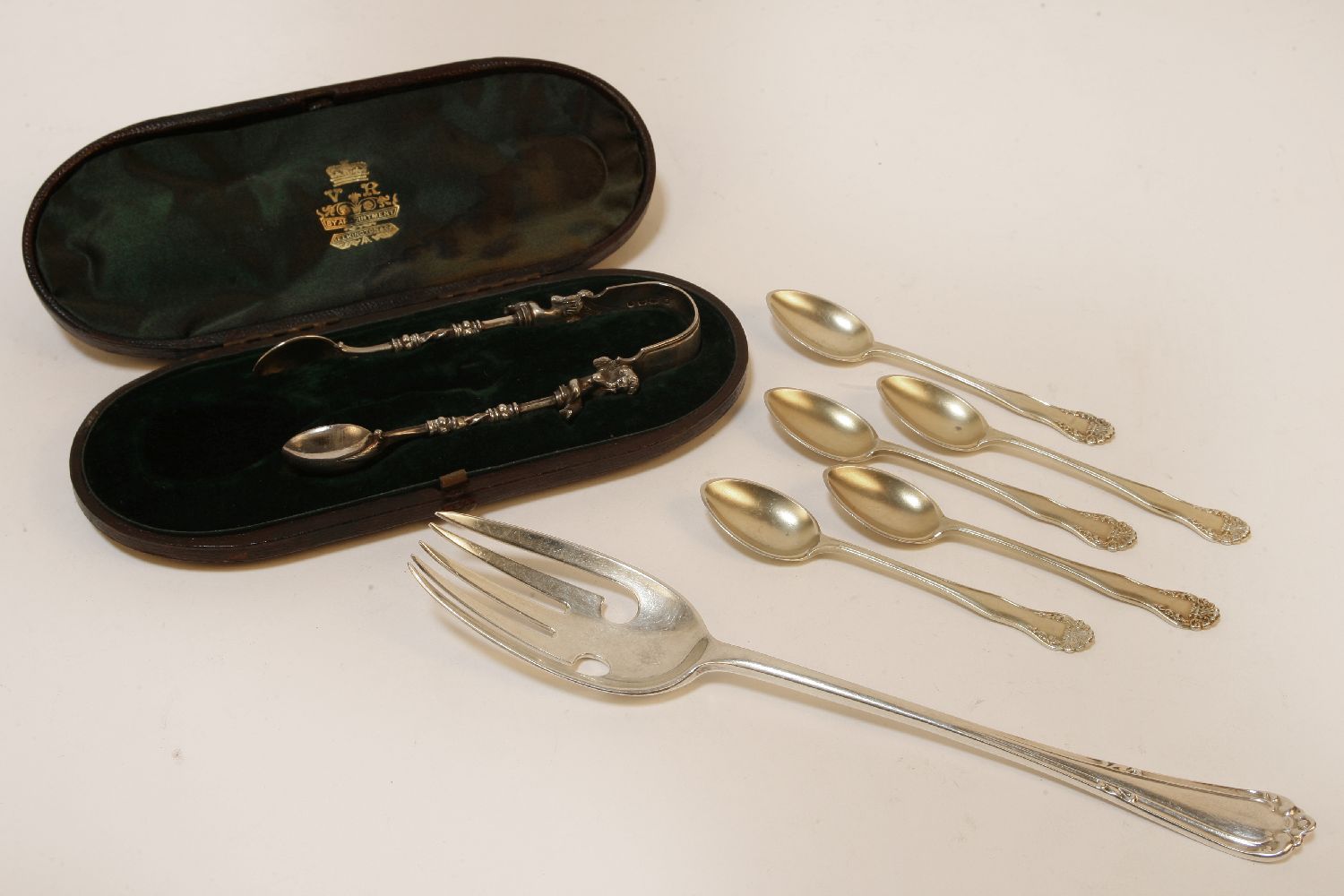 A set of five silver teaspoons, hallmarked, a cased pair of sugar tongs with cherub detail, and a - Image 2 of 2