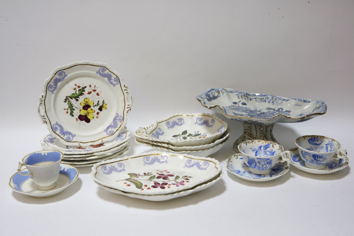 A collection of blue and white printed plates