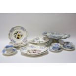 A collection of blue and white printed plates