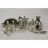 A large quantity of mixed silver plate, four piece tea service, cruet sets x 3, trophy cups, and a